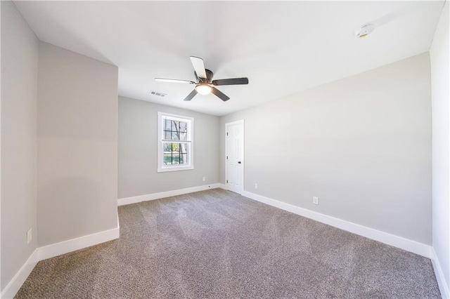 141 Nathan Rd, Atlanta, GA 30331 - carpeted spare room with baseboards and ceiling fan