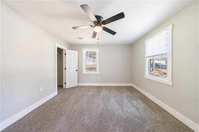 141 Nathan Rd, Atlanta, GA 30331 - carpeted spare room with ceiling fan and baseboards
