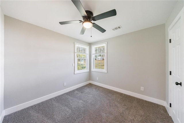 141 Nathan Rd, Atlanta, GA 30331 - unfurnished room featuring baseboards, dark carpet, and ceiling fan