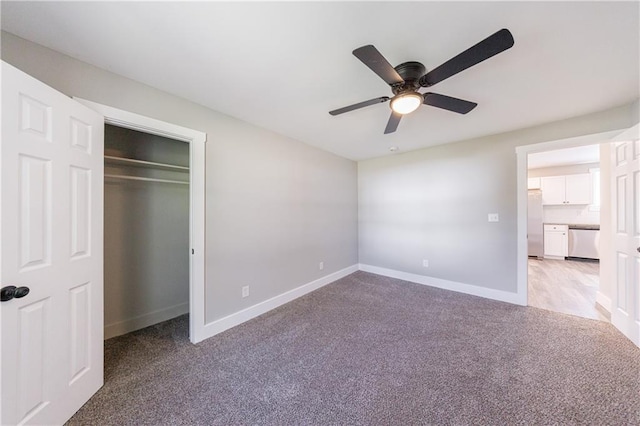 141 Nathan Rd, Atlanta, GA 30331 - unfurnished bedroom featuring light colored carpet, refrigerator, baseboards, a ceiling fan, and a closet