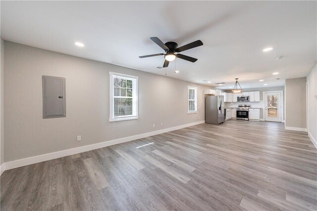 141 Nathan Rd, Atlanta, GA 30331 - unfurnished living room featuring electric panel, recessed lighting, baseboards, light wood-style floors, and ceiling fan
