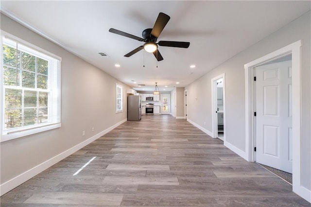 141 Nathan Rd, Atlanta, GA 30331 - unfurnished living room with healthy amount of natural light, a ceiling fan, recessed lighting, light wood-style floors, and baseboards