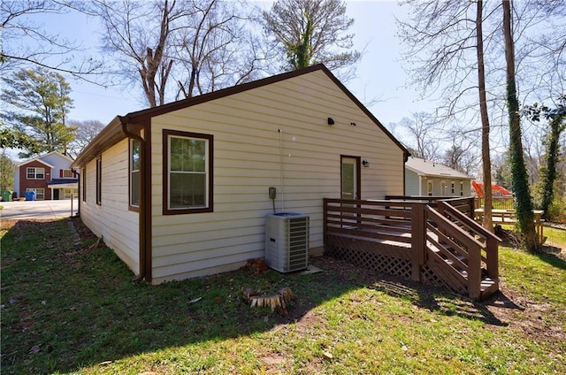 141 Nathan Rd, Atlanta, GA 30331 - back of property with a wooden deck, cooling unit, and a lawn