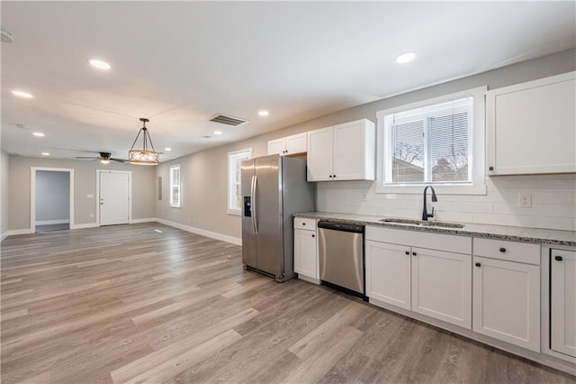 141 Nathan Rd, Atlanta, GA 30331 - kitchen featuring appliances with stainless steel finishes, a sink, a ceiling fan, backsplash, and recessed lighting