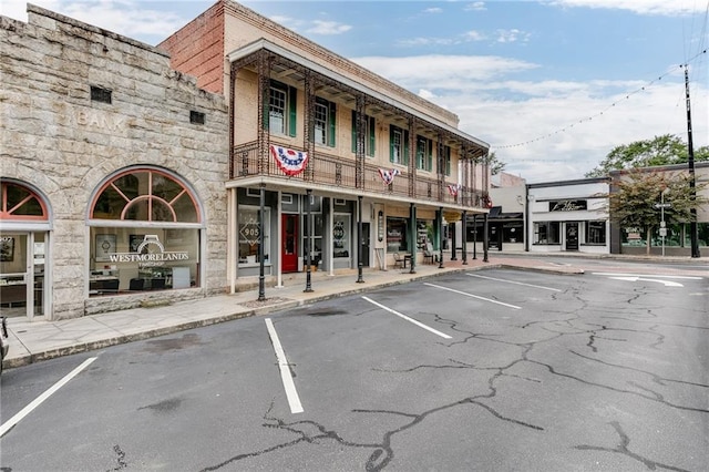 view of property with uncovered parking