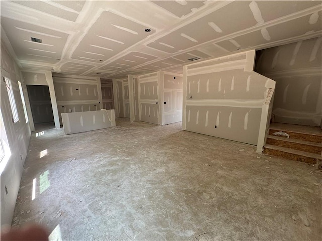 unfurnished living room featuring visible vents