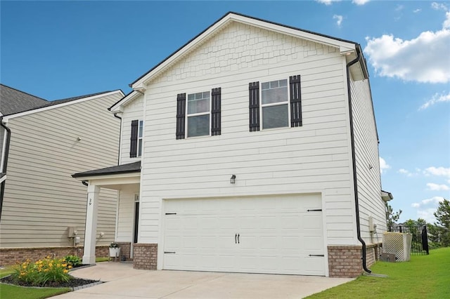 29 Gaston Ct, Hoschton, GA 30548 - view of front of house with a garage, a front lawn, concrete driveway, and brick siding