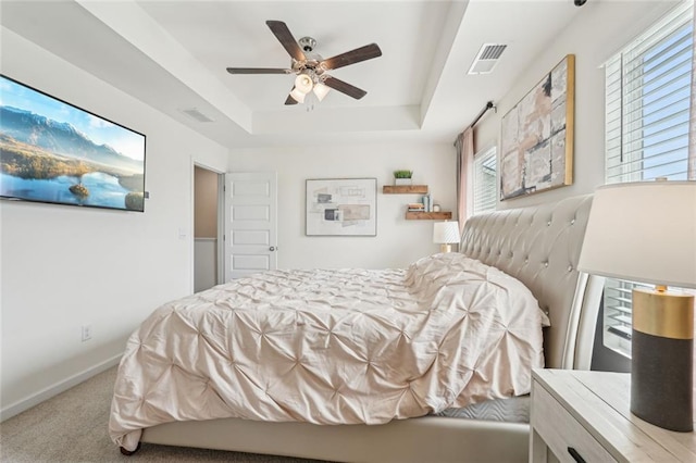 29 Gaston Ct, Hoschton, GA 30548 - carpeted bedroom with a raised ceiling, baseboards, and ceiling fan