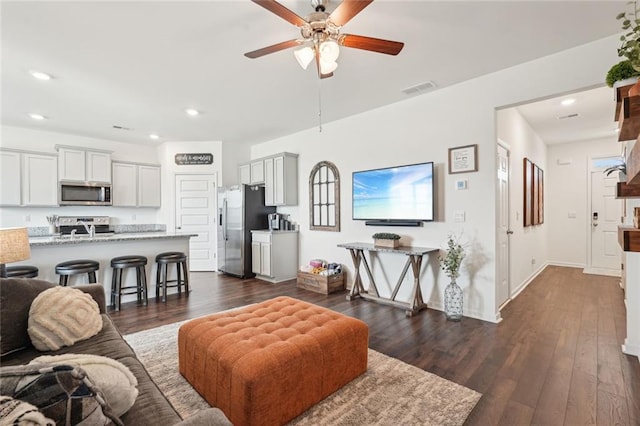 29 Gaston Ct, Hoschton, GA 30548 - living area with a ceiling fan, dark wood-style floors, recessed lighting, and baseboards