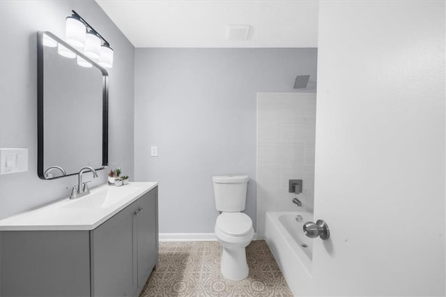 bathroom with tile patterned flooring, vanity, and toilet