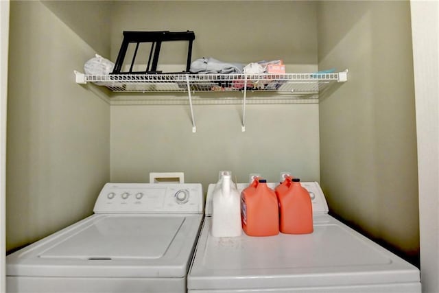 washroom with washing machine and dryer