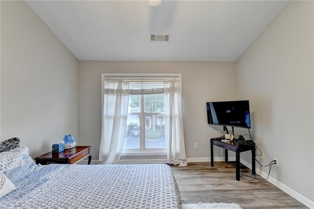 bedroom with light hardwood / wood-style floors