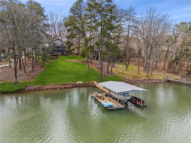 view of dock with a water view, a lawn, and boat lift