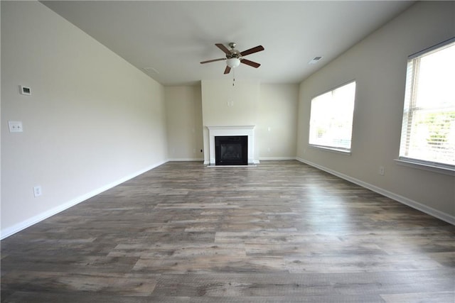 7753 Hansel Ln, Lithonia, GA 30058 - unfurnished living room featuring ceiling fan, a fireplace, and wood finished floors