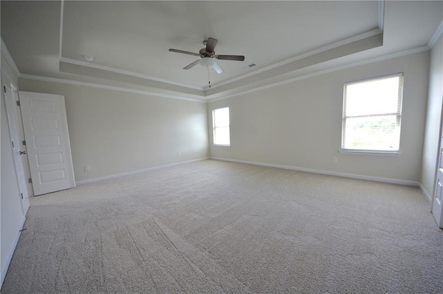 7753 Hansel Ln, Lithonia, GA 30058 - carpeted empty room with a tray ceiling, ornamental molding, and a ceiling fan