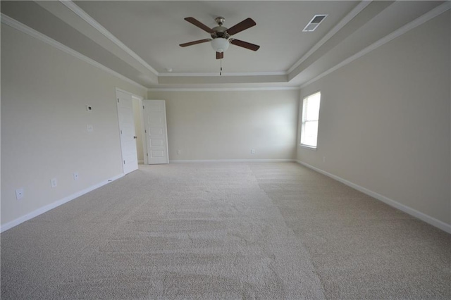 7753 Hansel Ln, Lithonia, GA 30058 - unfurnished room featuring a raised ceiling, ceiling fan, crown molding, and light colored carpet