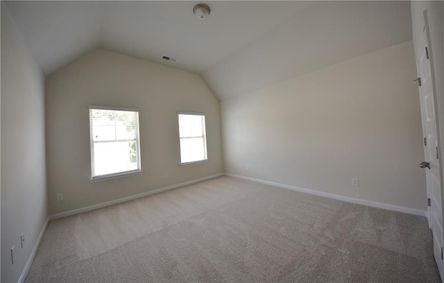 7753 Hansel Ln, Lithonia, GA 30058 - carpeted empty room featuring vaulted ceiling
