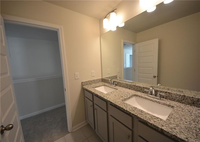 7753 Hansel Ln, Lithonia, GA 30058 - bathroom with double vanity and tile patterned flooring