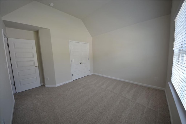 7753 Hansel Ln, Lithonia, GA 30058 - unfurnished bedroom with vaulted ceiling and carpet floors