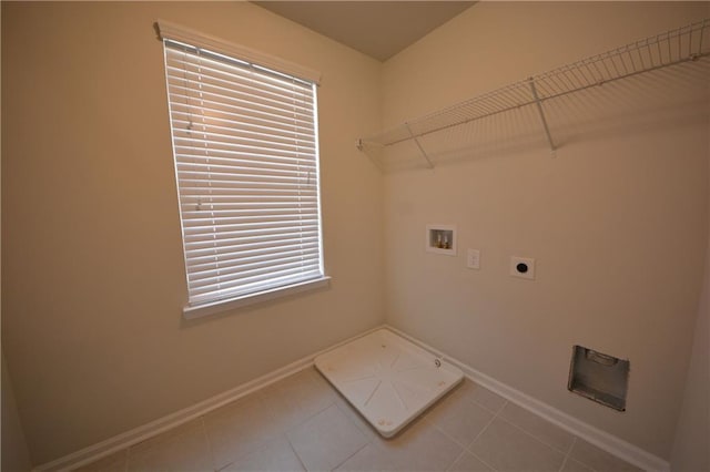 7753 Hansel Ln, Lithonia, GA 30058 - washroom with hookup for a washing machine, hookup for an electric dryer, and tile patterned floors