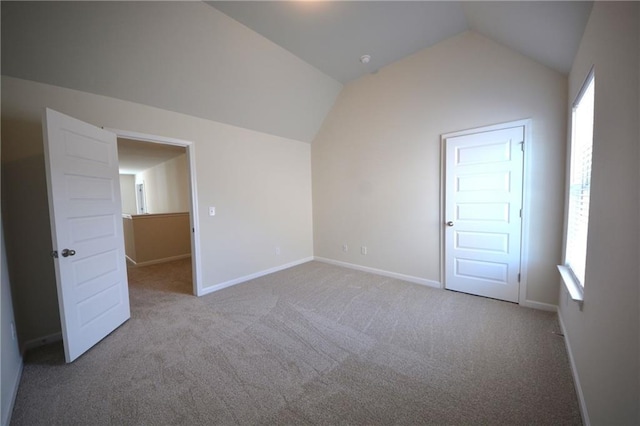 7753 Hansel Ln, Lithonia, GA 30058 - additional living space with vaulted ceiling, carpet flooring, and healthy amount of natural light