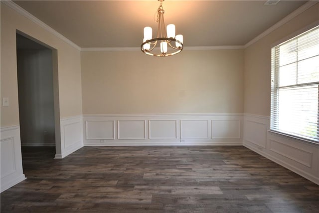 7753 Hansel Ln, Lithonia, GA 30058 - unfurnished room with a chandelier, healthy amount of natural light, ornamental molding, a wainscoted wall, and dark wood-style floors