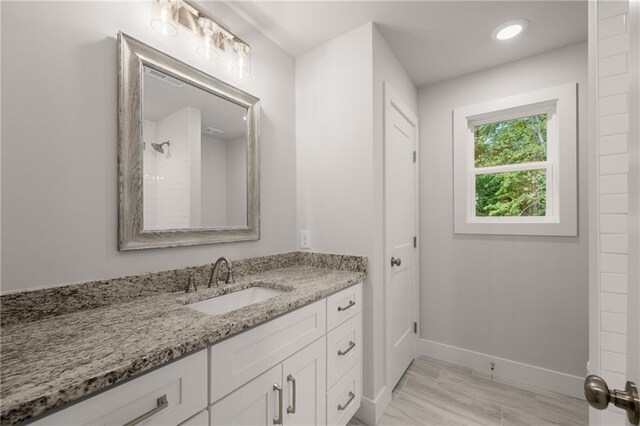 bathroom featuring vanity and walk in shower