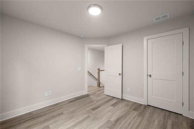 unfurnished bedroom with light hardwood / wood-style floors