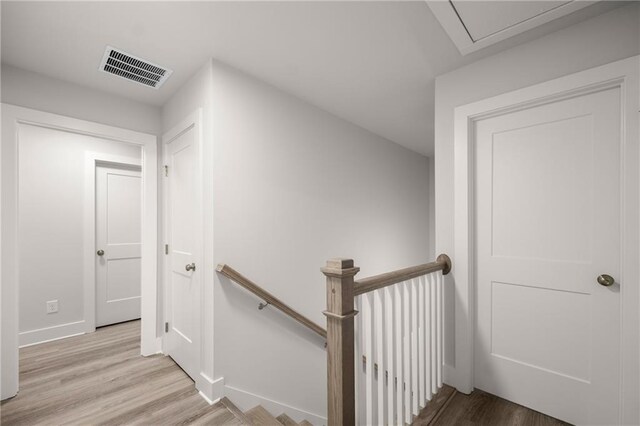 staircase featuring hardwood / wood-style flooring