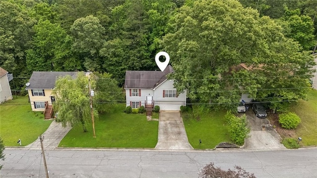 5519 Princeton Oaks Ln, Sugar Hill, GA 30518 - bi-level home with a garage, concrete driveway, and a chimney