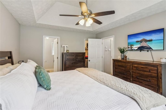 5519 Princeton Oaks Ln, Sugar Hill, GA 30518 - bedroom featuring a raised ceiling, a ceiling fan, and baseboards