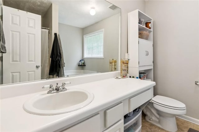 5519 Princeton Oaks Ln, Sugar Hill, GA 30518 - bedroom with a tray ceiling, light carpet, baseboards, a textured ceiling, and ceiling fan