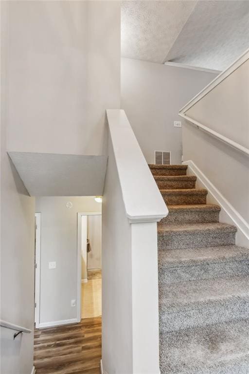 5519 Princeton Oaks Ln, Sugar Hill, GA 30518 - foyer entrance featuring light wood-type flooring, a high ceiling, plenty of natural light, and baseboards
