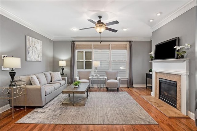 1604 Gilstrap Ln NW, Atlanta, GA 30318 - living area with crown molding, a ceiling fan, wood finished floors, recessed lighting, and a fireplace