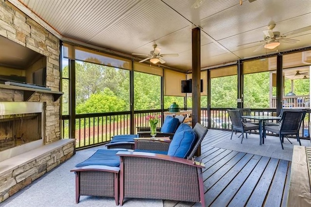 1604 Gilstrap Ln NW, Atlanta, GA 30318 - sunroom featuring ceiling fan, outdoor dining area, and an outdoor living space with a fireplace
