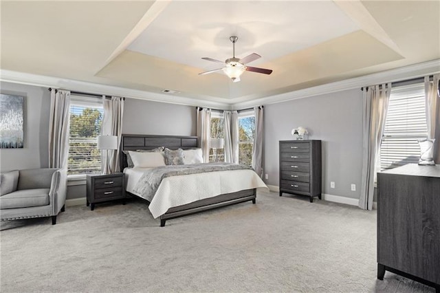 1604 Gilstrap Ln NW, Atlanta, GA 30318 - bedroom featuring a tray ceiling, light carpet, ceiling fan, and ornamental molding