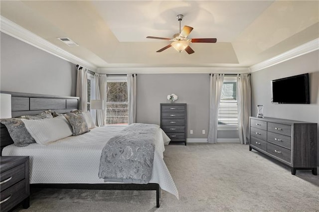 1604 Gilstrap Ln NW, Atlanta, GA 30318 - carpeted bedroom featuring a tray ceiling, crown molding, and ceiling fan