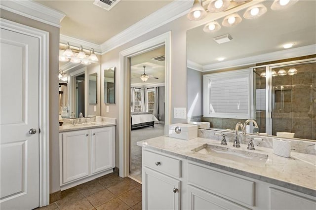 1604 Gilstrap Ln NW, Atlanta, GA 30318 - ensuite bathroom featuring ornamental molding, two vanities, a stall shower, a ceiling fan, and tile patterned flooring