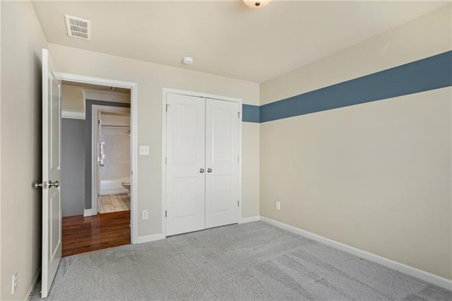 1604 Gilstrap Ln NW, Atlanta, GA 30318 - unfurnished bedroom with carpet floors and a closet