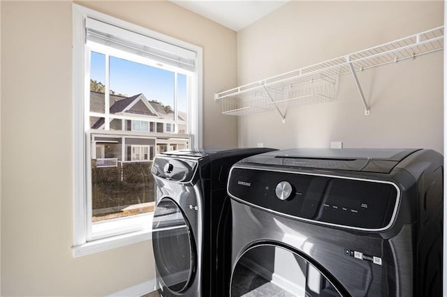 1604 Gilstrap Ln NW, Atlanta, GA 30318 - washroom featuring washer and clothes dryer and baseboards