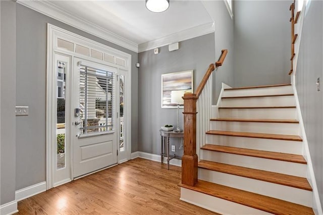 1604 Gilstrap Ln NW, Atlanta, GA 30318 - entryway with plenty of natural light, stairs, crown molding, and wood finished floors