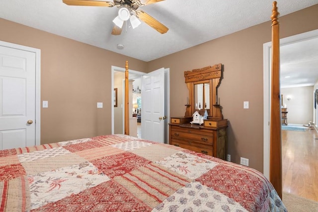 bedroom featuring wood-type flooring and ceiling fan