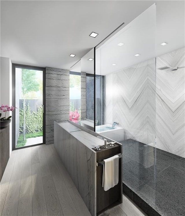 bathroom with a shower and hardwood / wood-style flooring