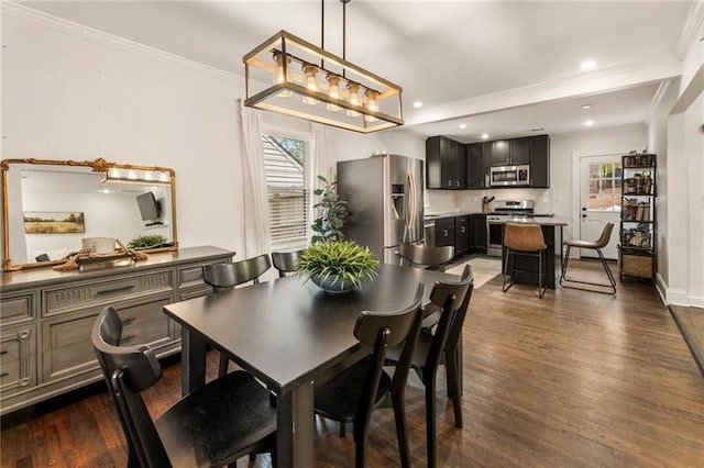 dining room featuring recessed lighting, baseboards, ornamental molding, and dark wood-style flooring