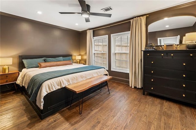 bedroom with visible vents, ceiling fan, ornamental molding, recessed lighting, and wood finished floors