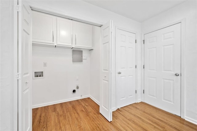 laundry room featuring electric dryer hookup, baseboards, light wood-style flooring, washer hookup, and cabinet space