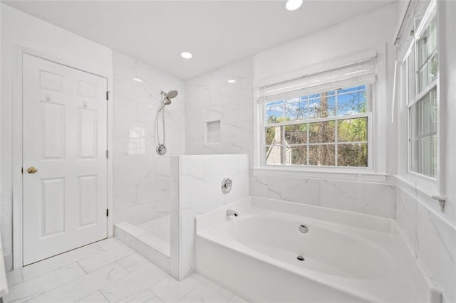 bathroom with a tile shower, recessed lighting, marble finish floor, and a garden tub