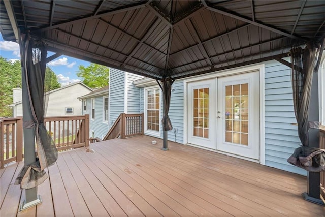 deck with a gazebo and french doors