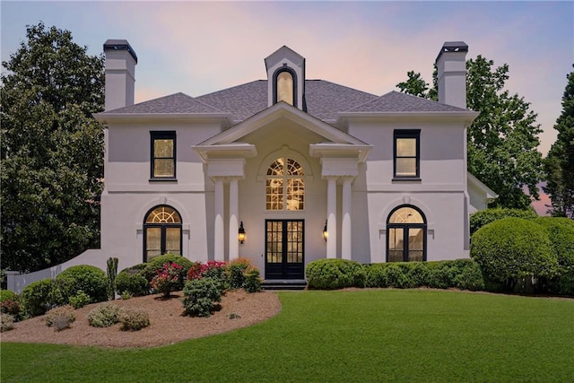 4011 Charrwood Trce, Marietta, GA 30062 - view of front of house with french doors, a front lawn, a chimney, and stucco siding