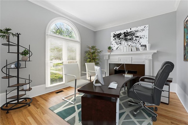 4011 Charrwood Trce, Marietta, GA 30062 - home office featuring crown molding, wood finished floors, a fireplace, and baseboards
